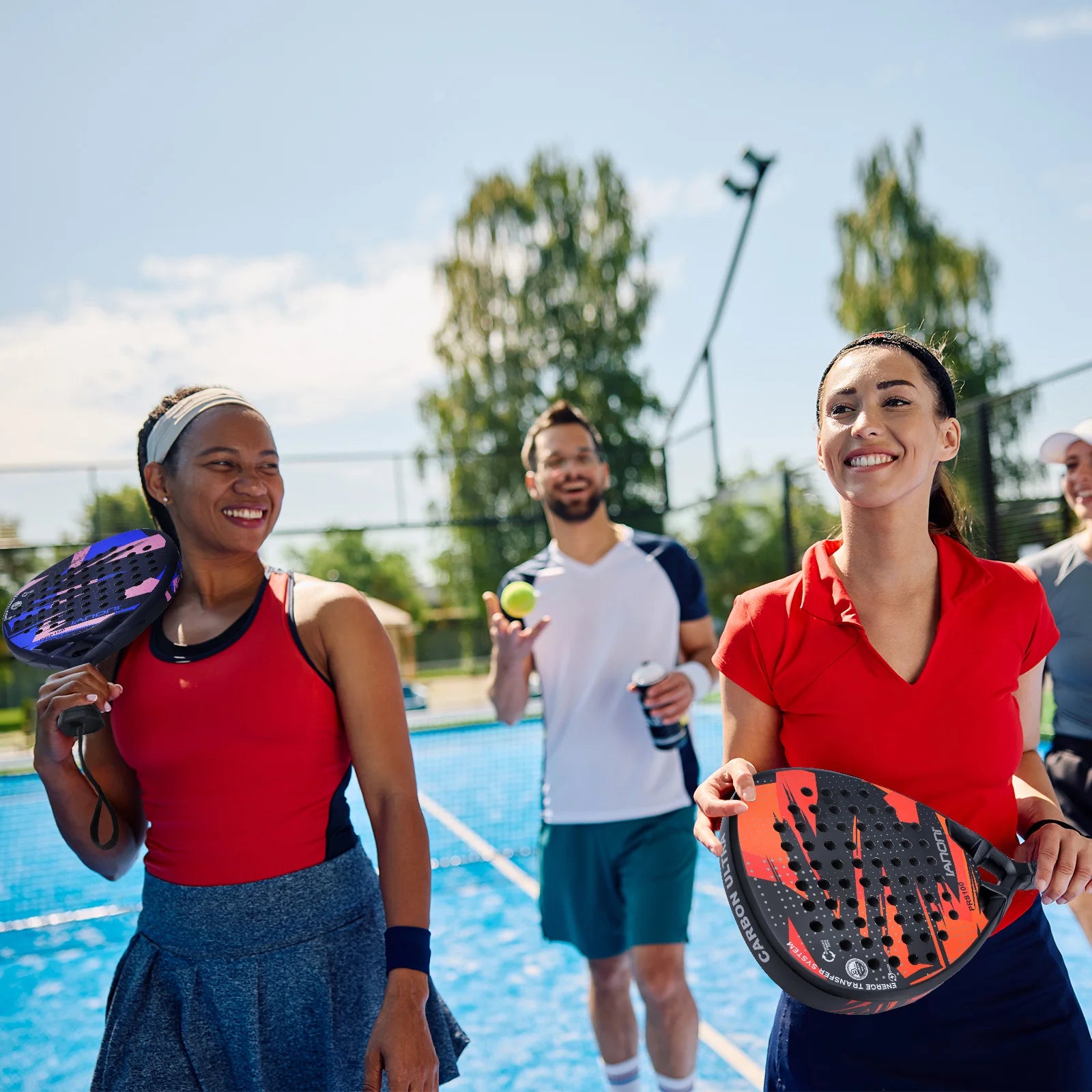 Smiling people playing padel on outdoor blue court, holding rackets, Vexo lifestyle scene
