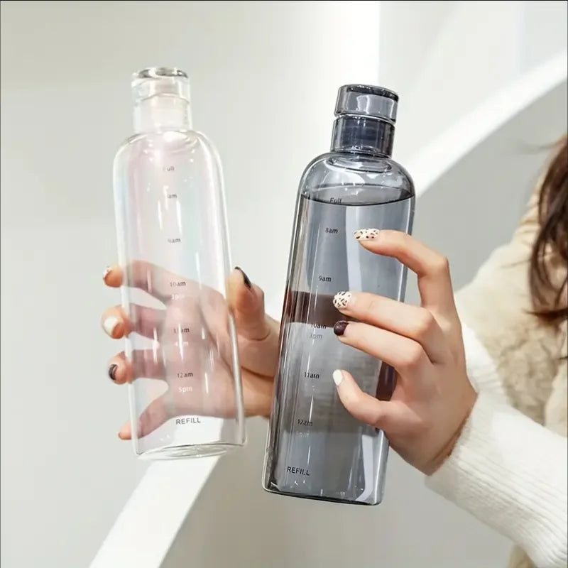 Two hands holding Vexo clear and black water bottles with time markers